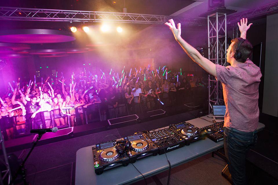 DJ SixFour, Derek Lombardo, gets the crowd pumped while he opens for Adventure Club at Washington State University in October of 2013.