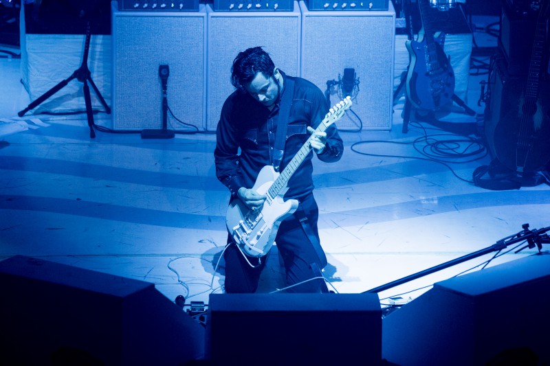 This is a photo of Jack White performing at the Paramount Theatre in 2014.