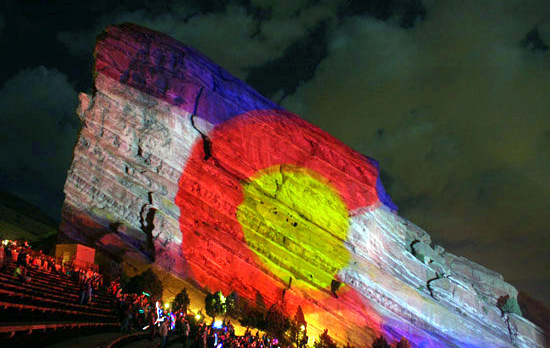 Colorado flag projected on the rocks at Red Rocks