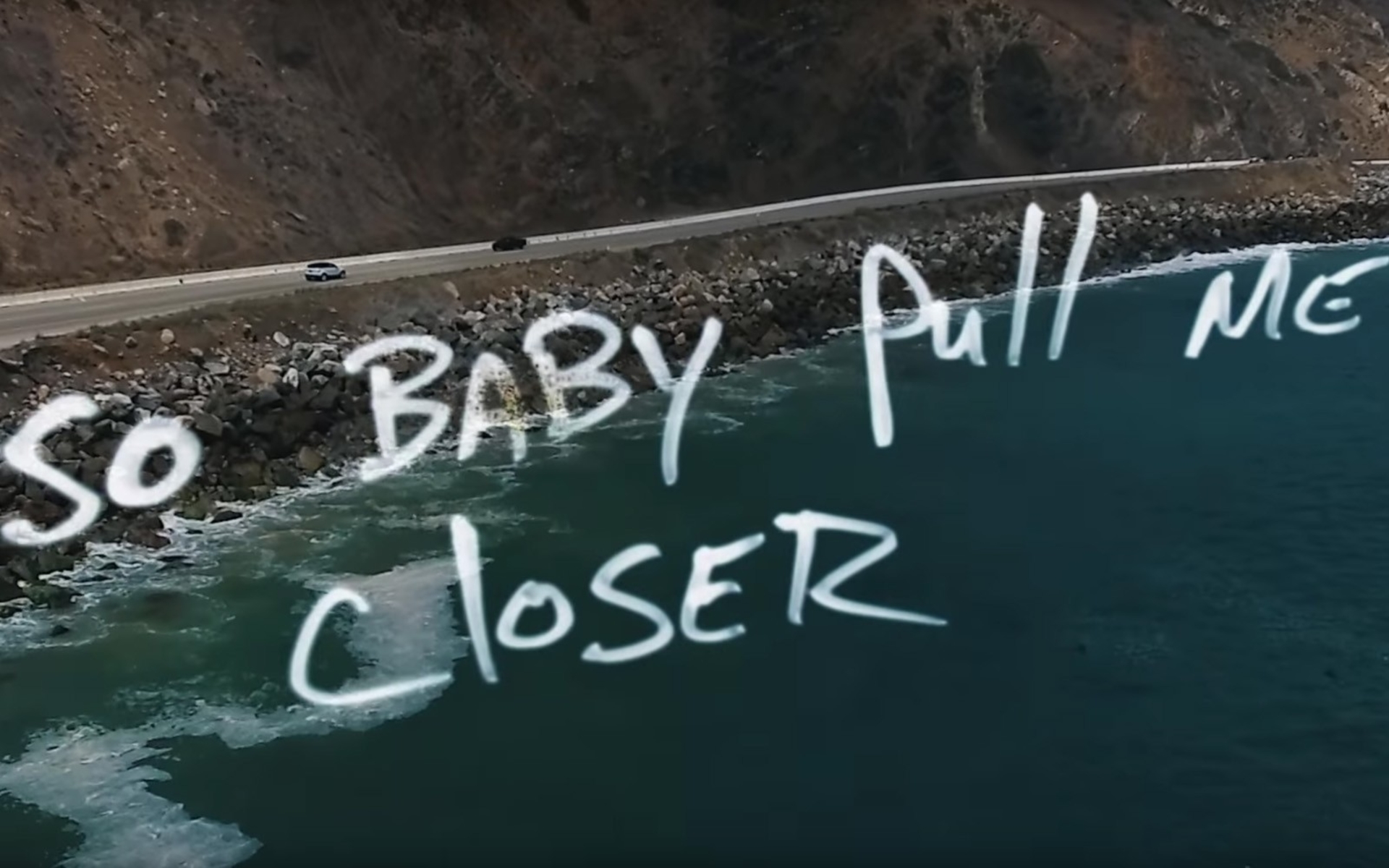 ocean shore with words "so baby pull me closer" in white