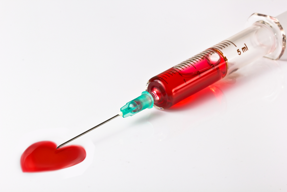 This is a picture of a hypodermic needle filled with red liquid