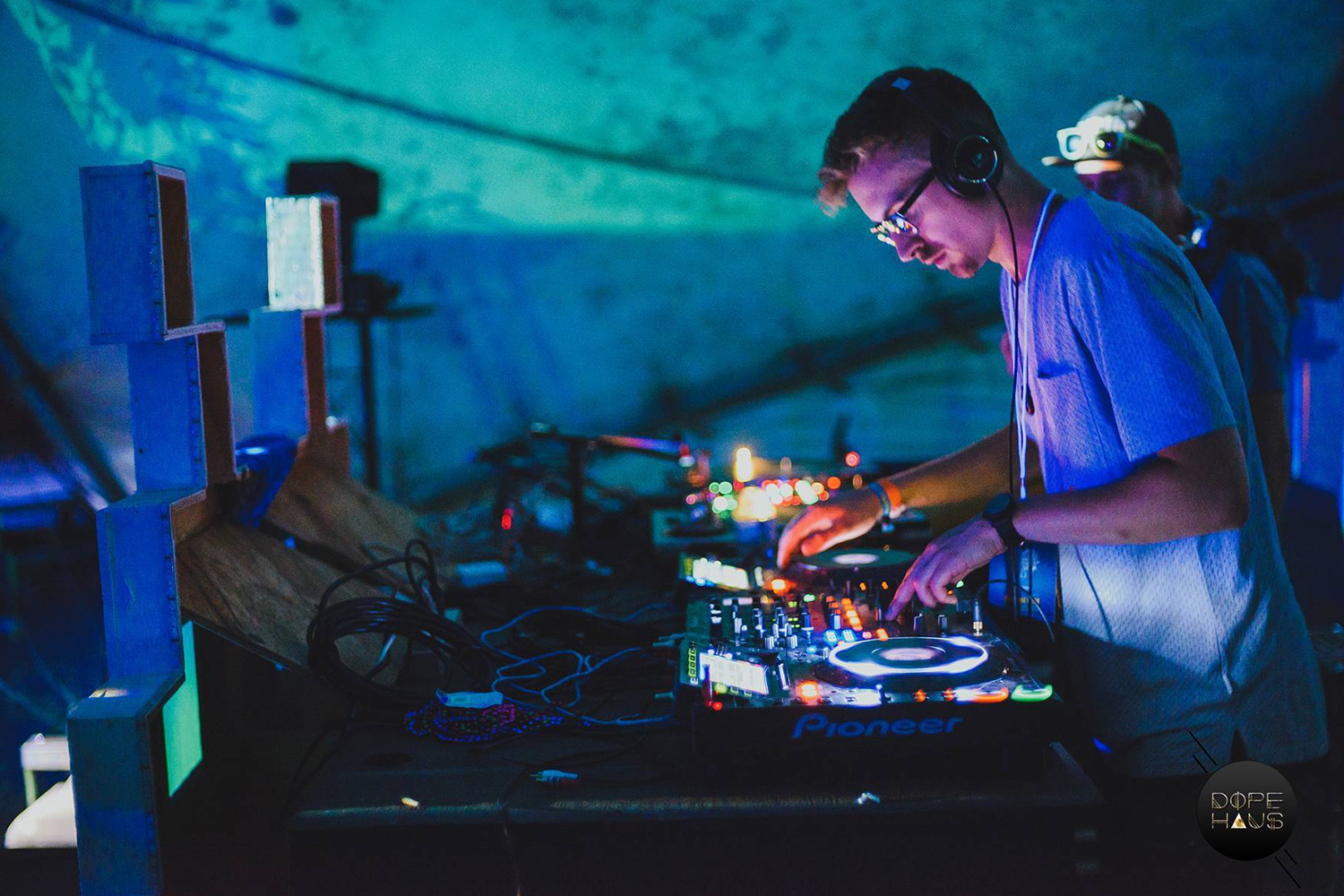 a guy with white shirt and glasses on the decks