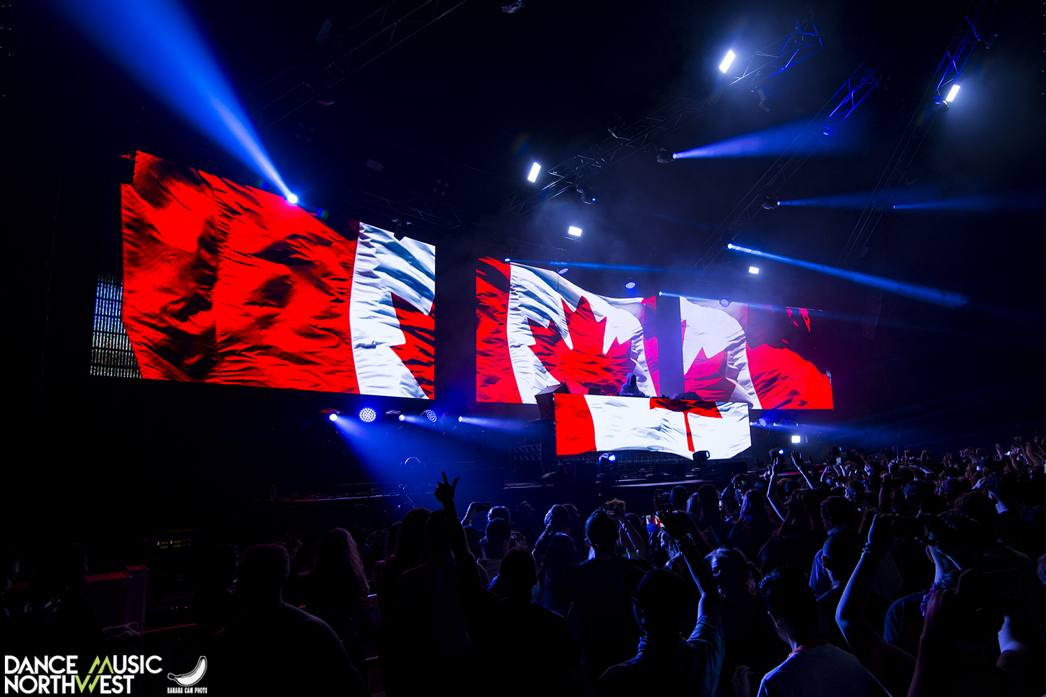 a canadian flag lit up on stagw