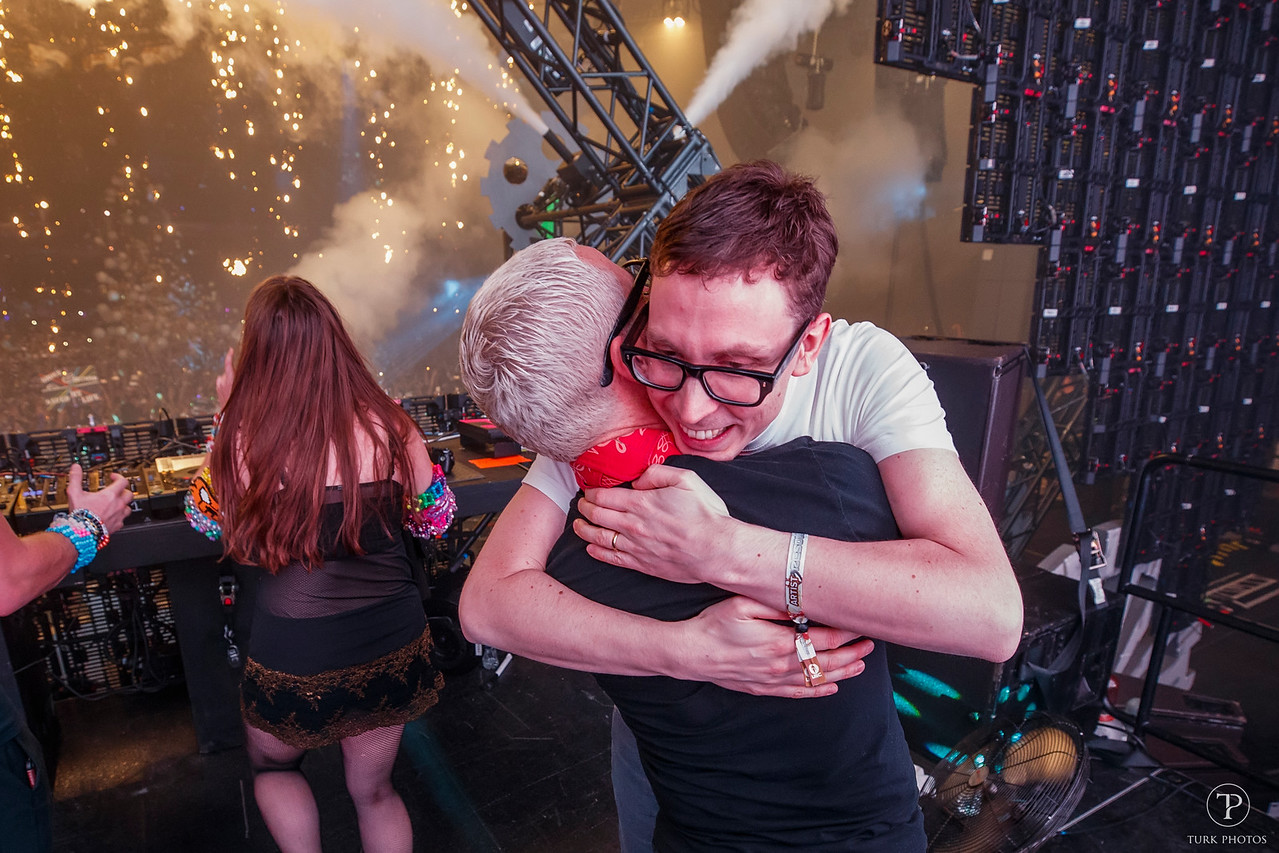 Paavo and Tony of Above and Beyond hugging in the DJ Booth