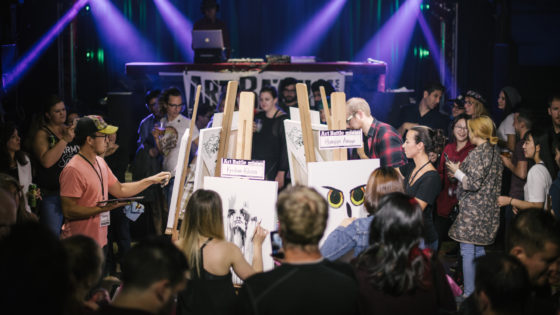 DJs and painters at an Art Battle