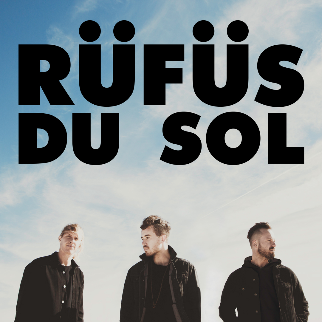 RUFUS DU SOL trio members stand below their group logo.
