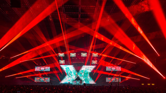 Excision bathes the crowd in red lazers at the Thunderdome tour in Tacoma, WA in 2020