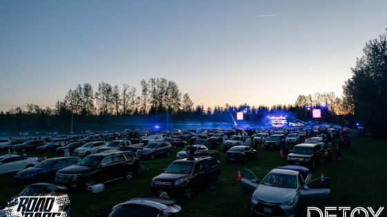 Image description: the crowd of cars facing the stage at Road Rage Drive-In