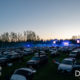 Image description: the crowd of cars facing the stage at Road Rage Drive-In