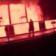 YouTube screen grab of RUFUS DU SOL performing On My Knees live at the Gorge Amphitheater with red and yellow stage lights.