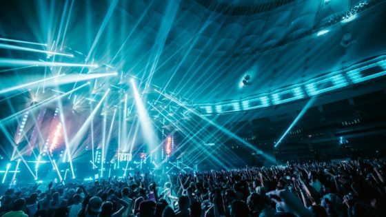 Contact Music Festival 2019 with a large crowd, bright blue lights, and Tiesto performing