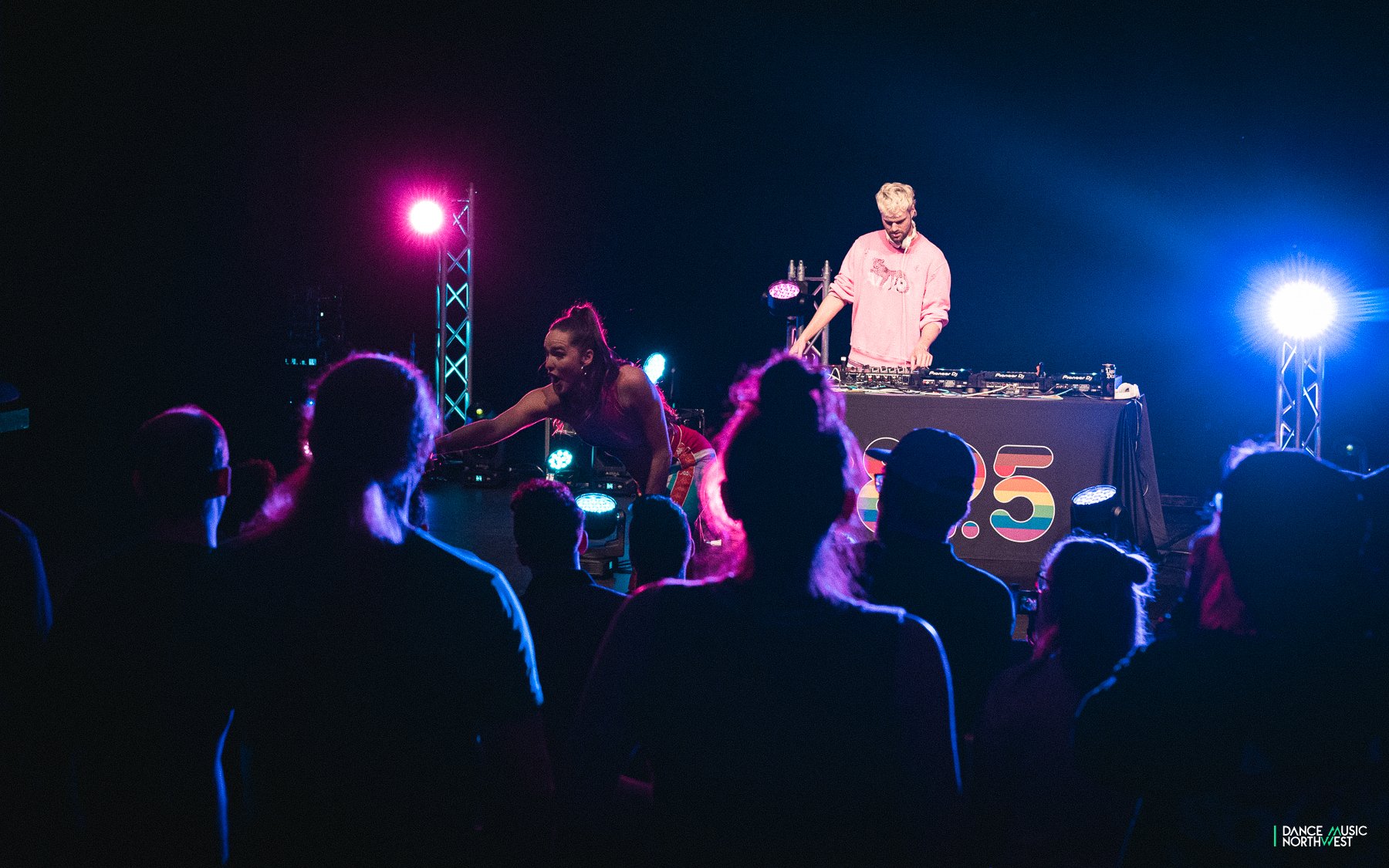 Sophie Hawley-Weld of Sofi Tukker reaches out to a fan in the crowd from the C895 stage