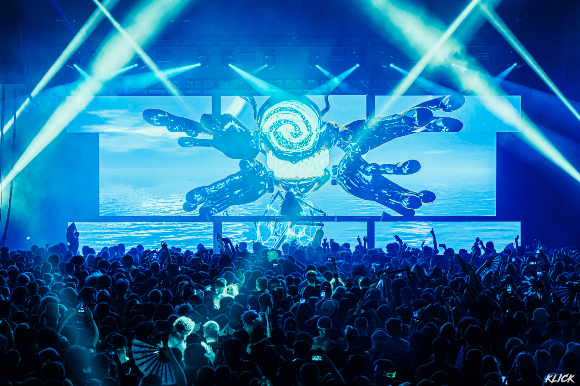 Subtronics performing with blue cyclops visuals