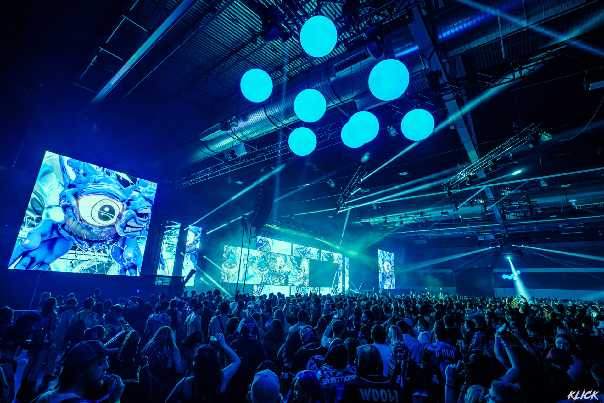 Subtronics performing with blue cyclops visuals