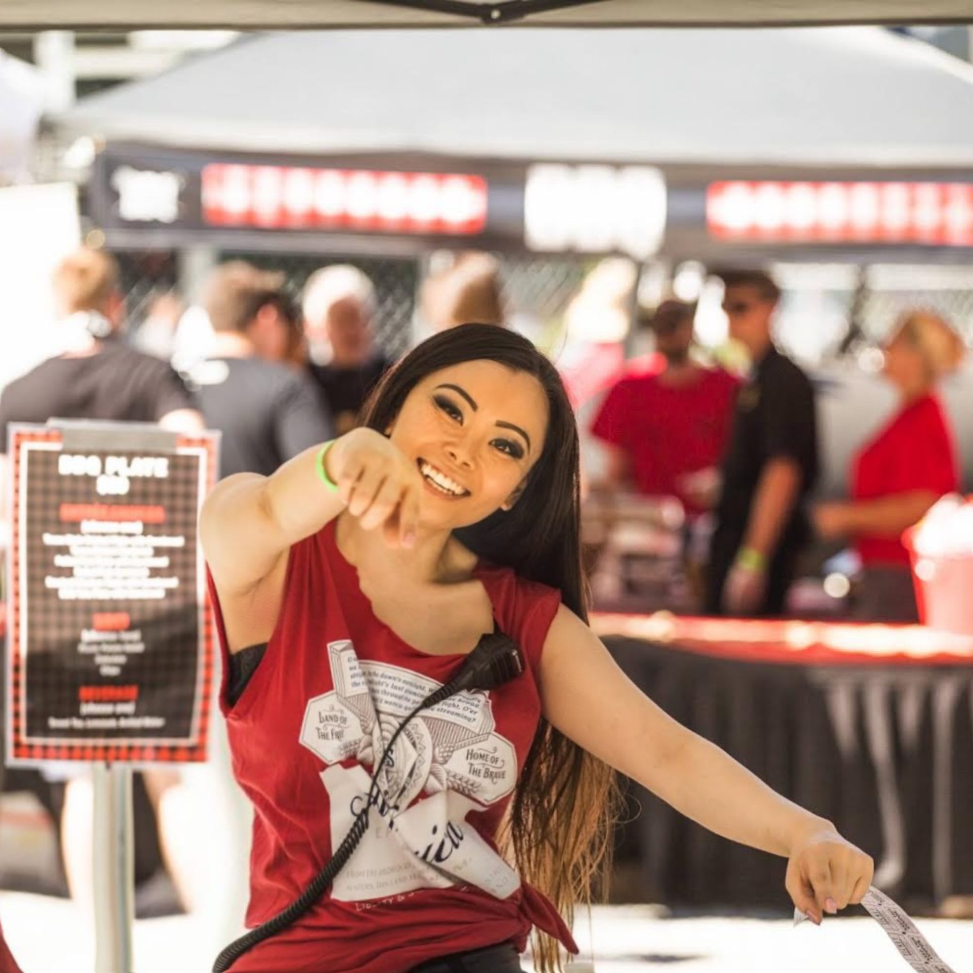 Michelle Nguyen of Upper Left wearing a red shirt and smiling