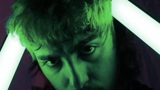 Portrait of pherns with green light shiningn on his face