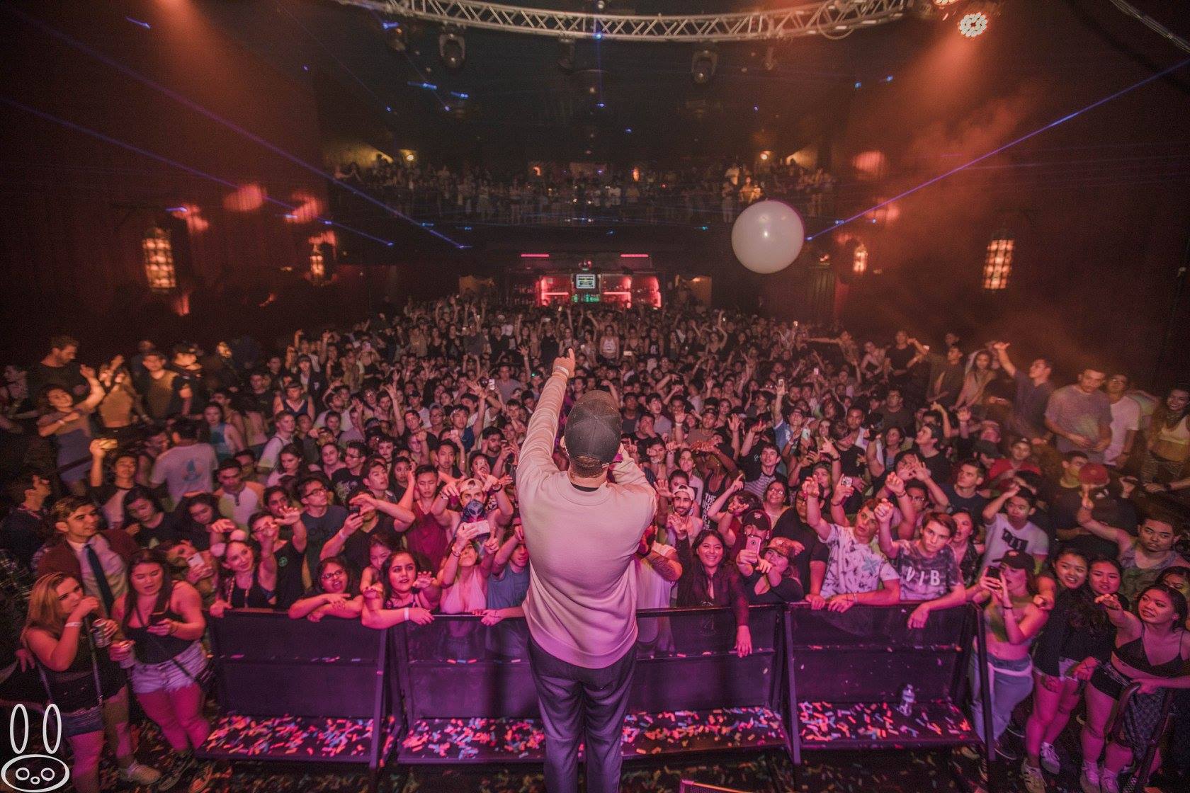 San Holo reaching out to the crowd