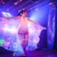 A performance artist dances at the Butterfly Stage at the Exotic Butterfly Garden event held at the Railway Club