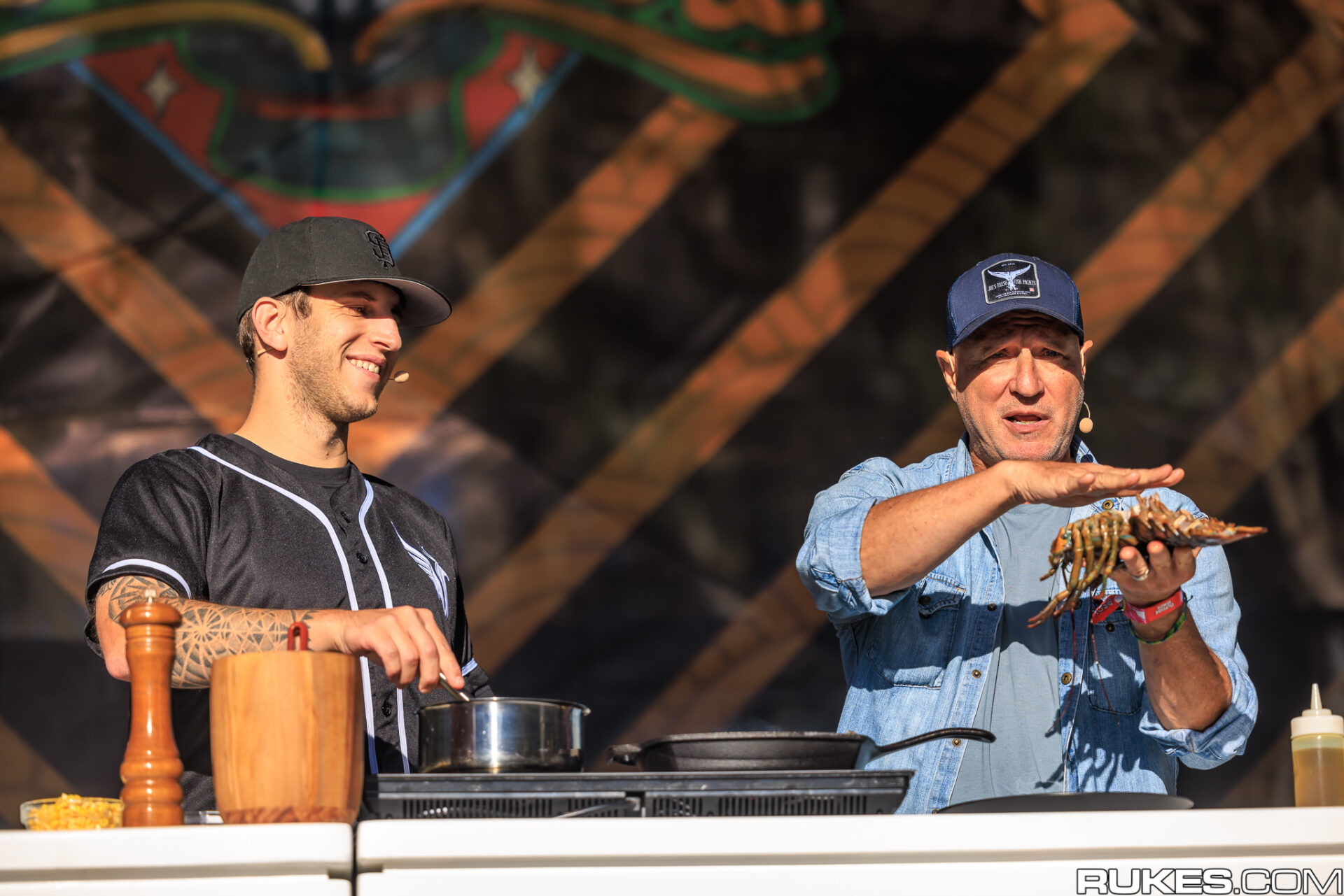 Illenium and Chef Tom Colicchio making lobster risotto at the GastroMagic Culinary Stage OSL 2022