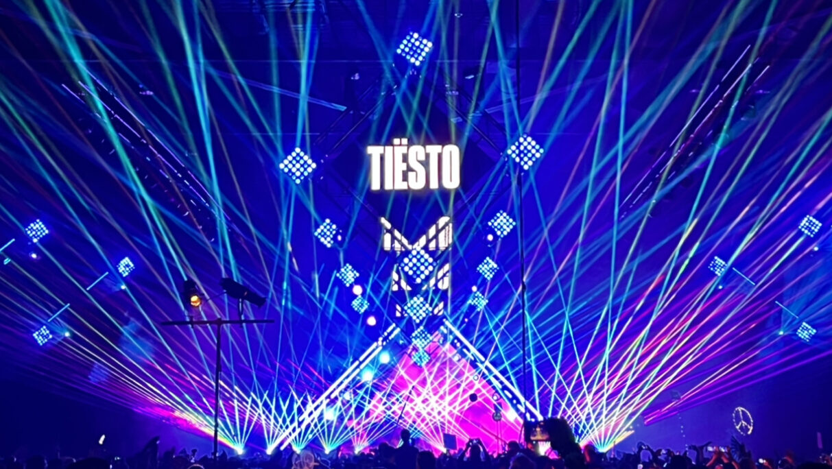 Tiesto playing the main stage at Boo! Seattle with lasers and multi tiered screens.