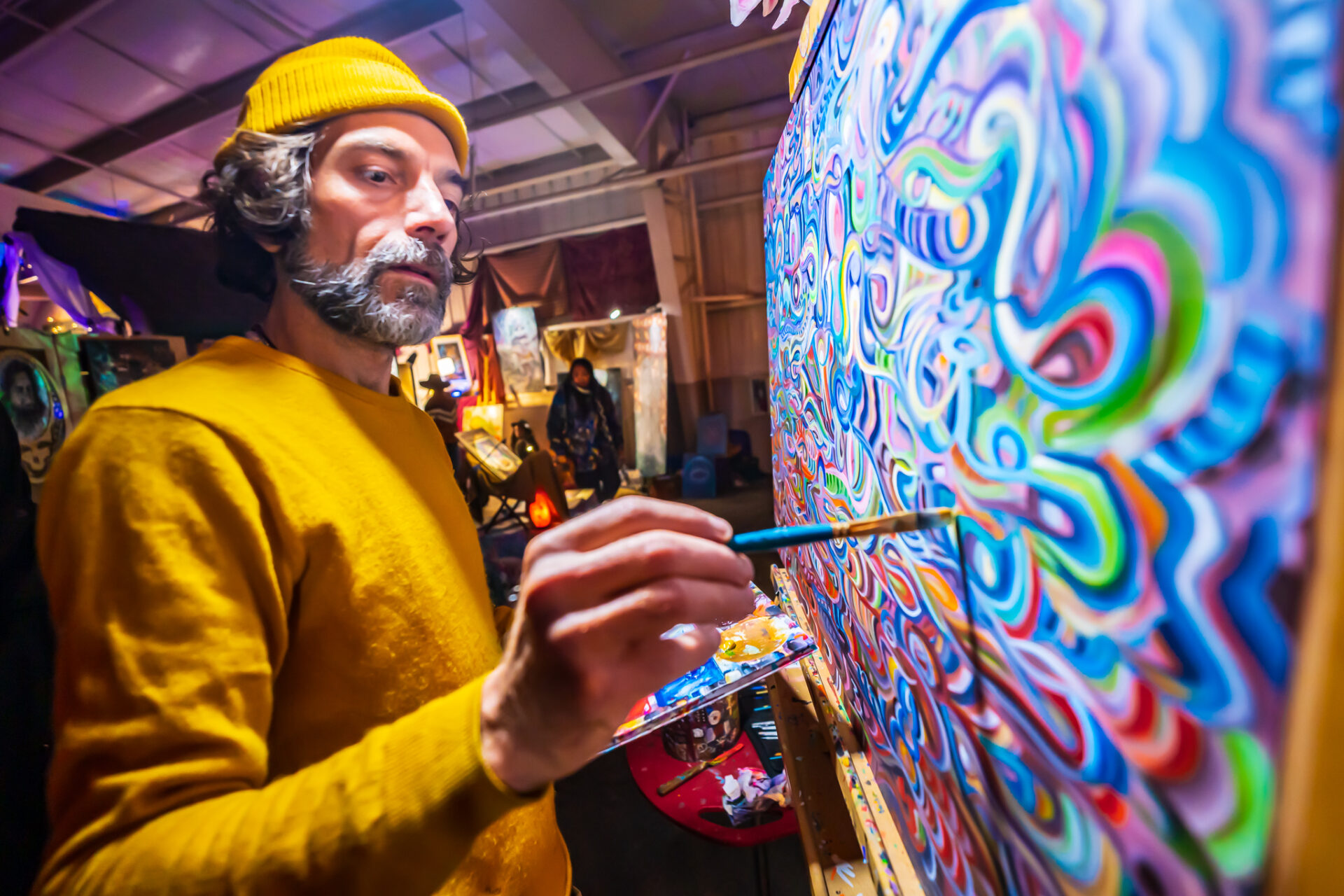 a man painting a live painting at cascade equinox festival
