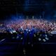 pic of Audien and Jason Ross standing on stage with crowd behind posing for picture from Seattle show 2024.