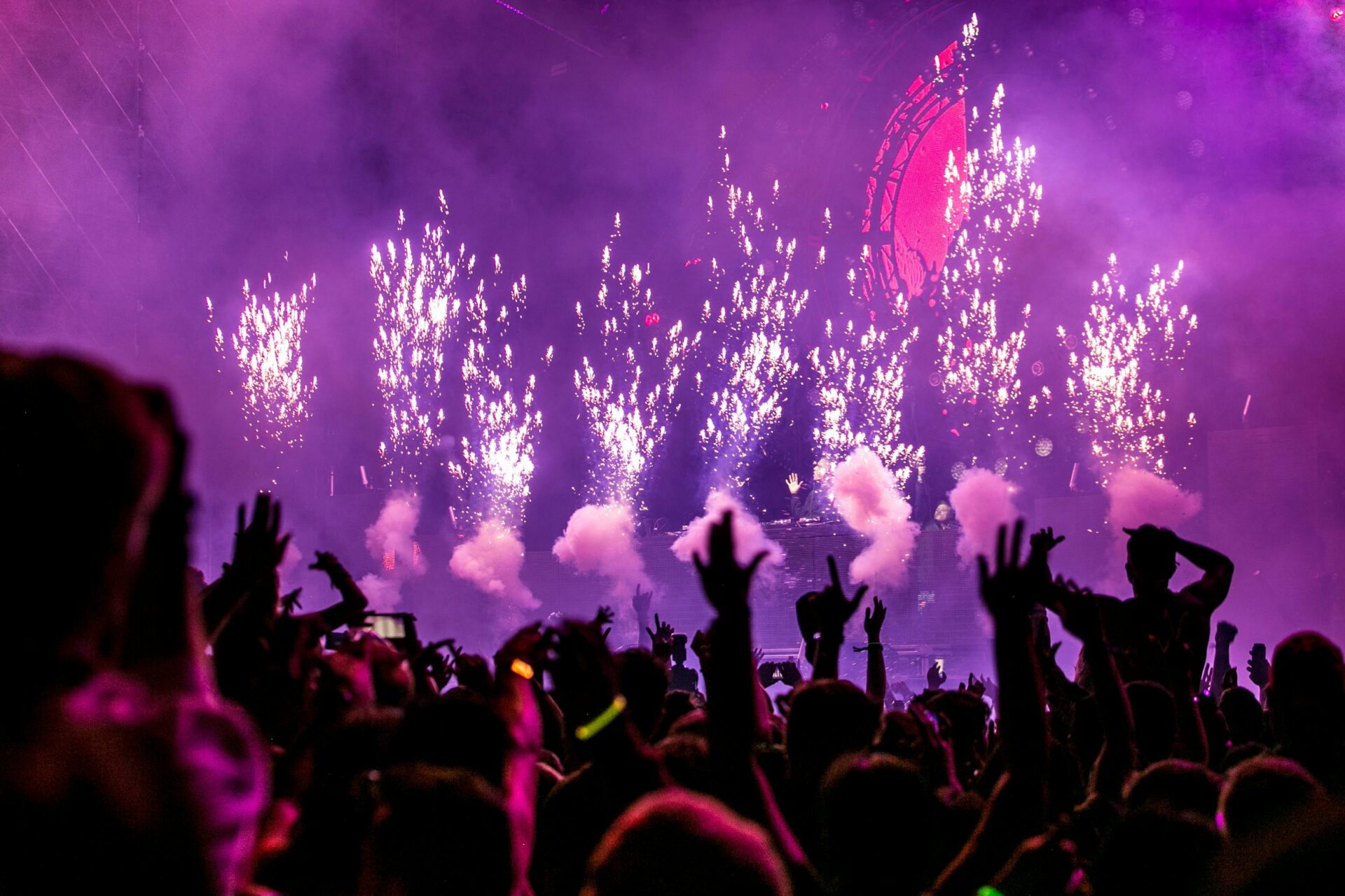 fireworks with dancing crowd