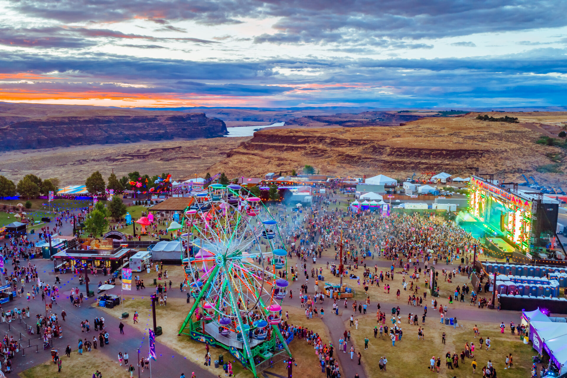view of the main festival grounds with the ferris wheel, Mad Hatter's Castle, and the Gorge
